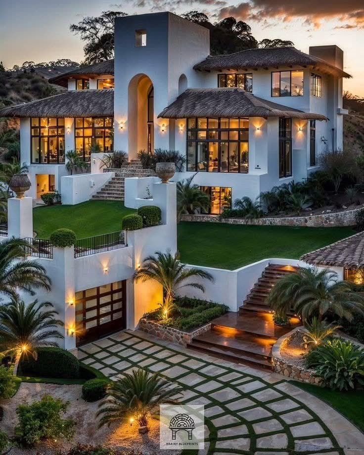 Private villa with thatched roof, terraced garden and pool, built on a sloped plot